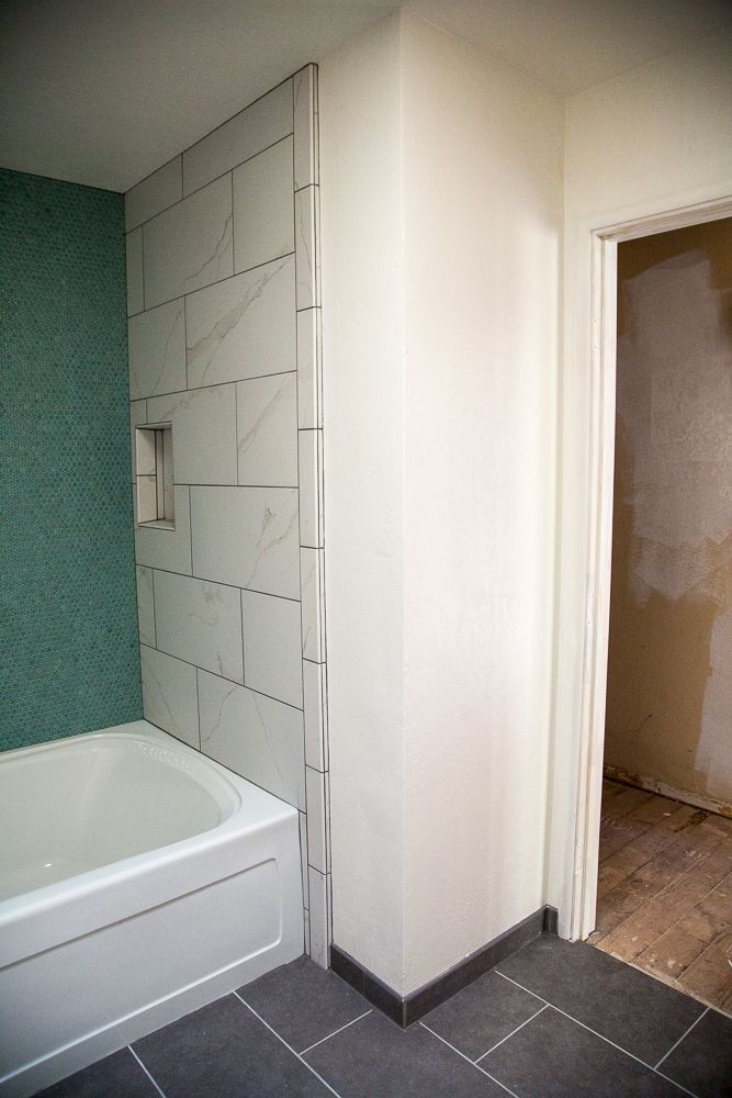 This bathroom entrance is in the main hallway.