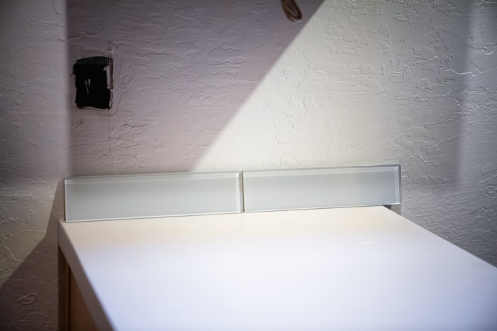Kitchen counter and two glass tiles for backsplash